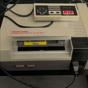 Nintendo system w 4 video games; 2 remotes ; gun